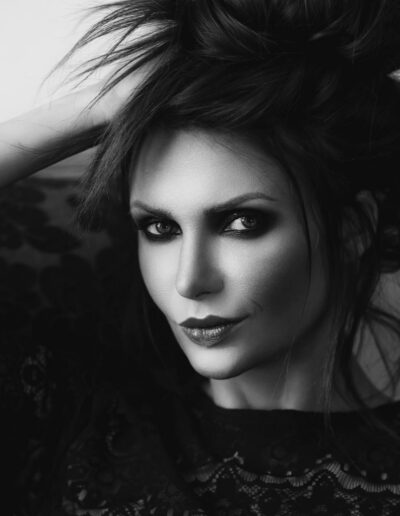 Black and white fashion portrait with dramatic smoky eye makeup