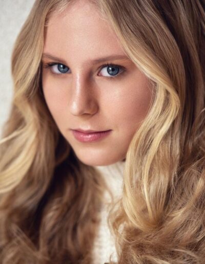 Blonde woman with soft waves in a close-up beauty portrait