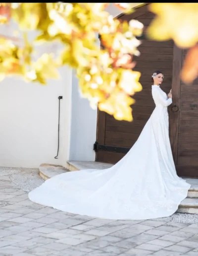 Woman wearing a dramatic pink ruffled bridal fashion gown