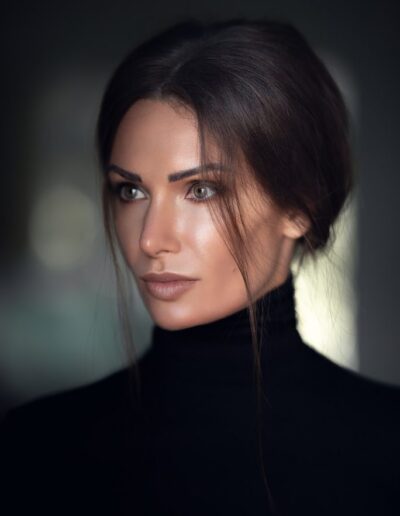 Brunette woman with elegant updo in a studio beauty portrait
