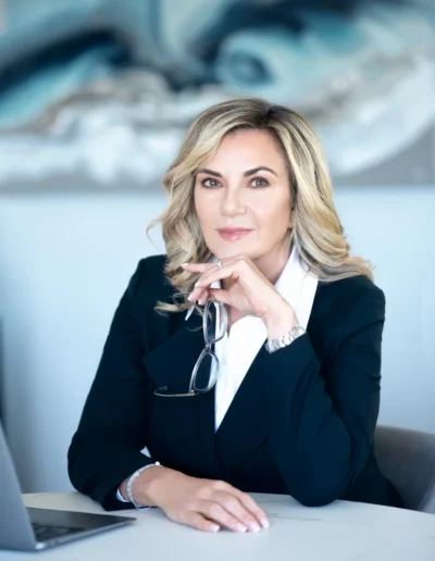 Businesswoman seated at a desk for a professional office headshot