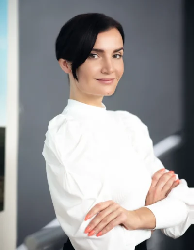 Businesswoman in a white blouse posing for a professional headshot