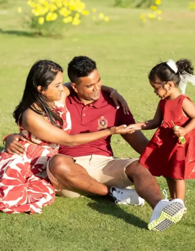 Parents and young daughter enjoying an outdoor family portrait