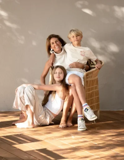 Mother with her son and daughter posing together in natural light