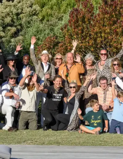 Group of guests posing together at an outdoor Cape Town event